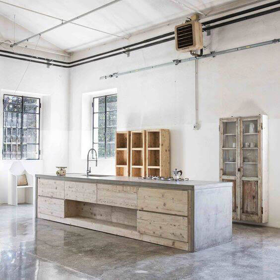 A kitchen with a large island and cabinets in it